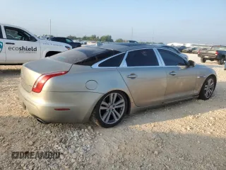 2014 Jaguar XJ Portfolio with VIN SAJWJ2GD7E8V61558, listed as a Copart auction lot 66850034 with 130,984 mi miles and Salvage title. Bid and sale history available at DreamBid. Image 3.