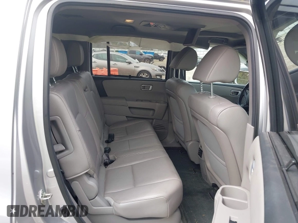 2014 Honda Pilot Touring with VIN 5FNYF4H91EB011934, listed as a IAAI auction lot 41929415 with 227,343 mi miles and . Bid and sale history available at DreamBid. Image 8.