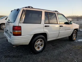 1996 Jeep Grand Cherokee z VIN 1J4FX78S6TC221815, wystawiony jako Copart lot #44000615 z przebiegiem 287 308 mil mil oraz Szkoda całkowita • Salvage title. Historia ofert i sprzedaży dostępna na DreamBid. Obrazek 3.