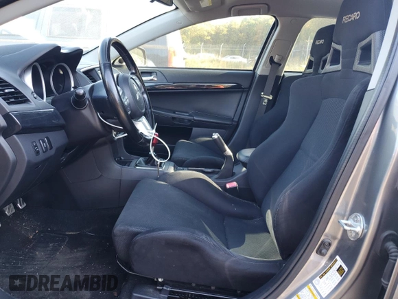 2014 Mitsubishi Lancer Evolution GSR z VIN JA32W8FV6EU018171, wystawiony jako Copart lot #77109934 z przebiegiem 83 467 mil mil oraz Tytuł czysty. Historia ofert i sprzedaży dostępna na DreamBid. Obrazek 7.
