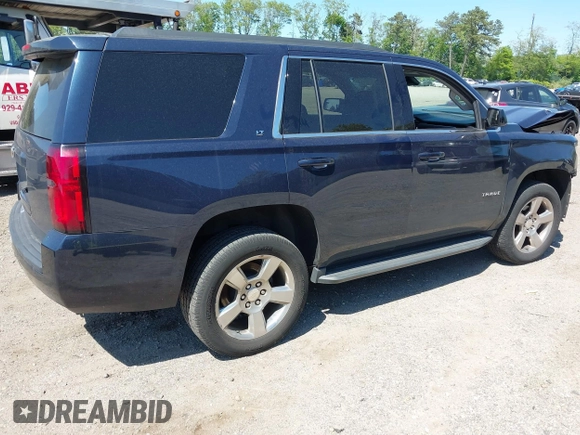 2020 Chevrolet Tahoe LT with VIN 1GNSKBKC6LR239081, listed as a IAAI auction lot 42298842 with 125,328 mi miles and . Bid and sale history available at DreamBid. Image 4.