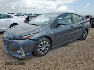 2021 Toyota Prius LE with VIN JTDKAMFP3M3185974, listed as a Copart auction lot 59931435 with 128,835 mi miles and Salvage title. Bid and sale history available at DreamBid. Image 1.