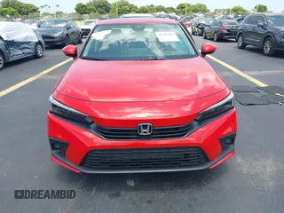 2023 Honda Civic Touring with VIN 2HGFE1F94PH323451, listed as a IAAI auction lot 42383422 with 6,120 mi miles and . Bid and sale history available at DreamBid. Image 12.