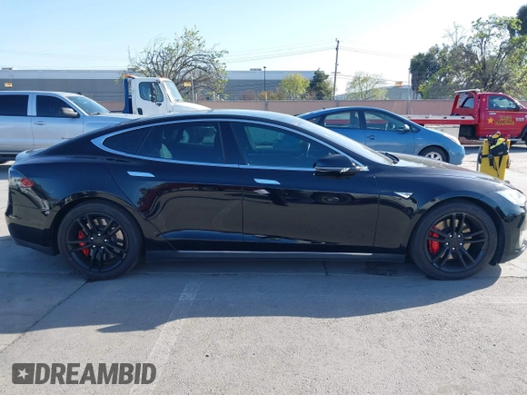 2014 Tesla Model S P85D with VIN 5YJSA1H22EFP65530, listed as a IAAI auction lot 41959941 with 76,532 mi miles and . Bid and sale history available at DreamBid. Image 13.