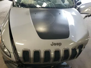 2014 Jeep Cherokee Trailhawk with VIN 1C4PJMBSXEW213981, listed as a Copart auction lot 60440495 with 136,612 mi miles and Salvage title. Bid and sale history available at DreamBid. Image 12.