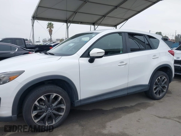 2016 Mazda CX-5 Grand Touring with VIN JM3KE4DY7G0737232, listed as a IAAI auction lot 42158279 with Not Provided miles and . Bid and sale history available at DreamBid. Image 14.