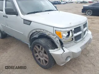 2010 Dodge Nitro SE with VIN 1D4PT2GK8AW144406, listed as a IAAI auction lot 41590691 with 165,959 mi miles and . Bid and sale history available at DreamBid. Image 6.