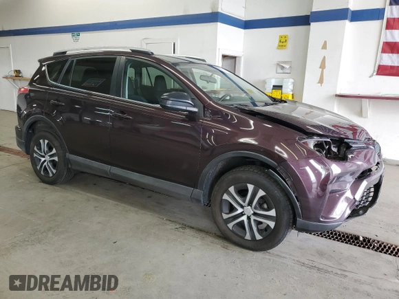 2016 Toyota RAV4 LE with VIN 2T3BFREV3GW490181, listed as a Copart auction lot 52457435 with 128,267 mi miles and Salvage Title. Bid and sale history available at DreamBid. Image 4.