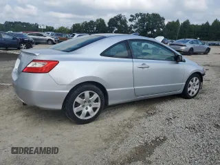 2009 Honda Civic Cpe LX with VIN 2HGFG12629H521583, listed as a Copart auction lot 66502414 with 136,478 mi miles and Salvage Title. Bid and sale history available at carsss.com. Image 3.