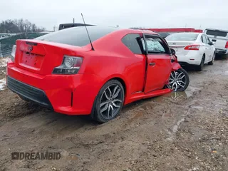 2015 Scion tC z VIN JTKJF5C79FJ013303, wystawiony jako IAAI lot #41581714 z przebiegiem Nie podano mil oraz . Historia ofert i sprzedaży dostępna na DreamBid. Obrazek 4.