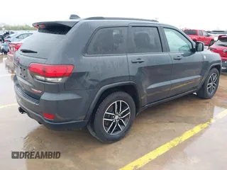 2018 Jeep Grand Cherokee Trailhawk with VIN 1C4RJFLG6JC320763, listed as a IAAI auction lot 41871683 with 115,417 mi miles and . Bid and sale history available at DreamBid. Image 4.