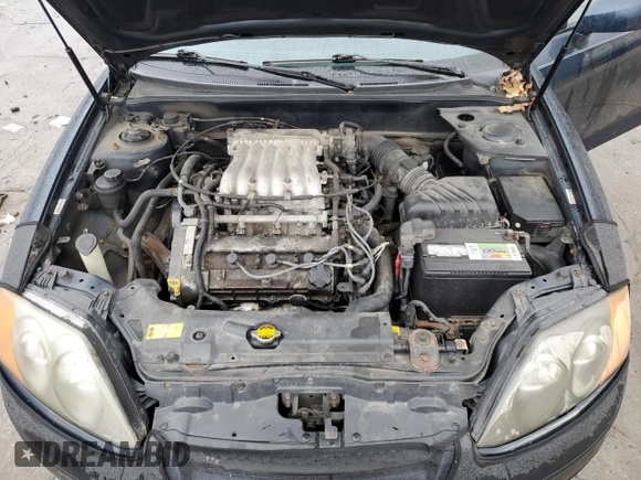 2003 Hyundai Tiburon GT z VIN KMHHN65F13U068658, wystawiony jako Copart lot #81799404 z przebiegiem 163 148 mil mil oraz Szkoda całkowita • Salvage title. Historia ofert i sprzedaży dostępna na DreamBid. Obrazek 11.