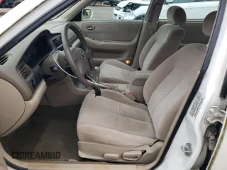 2001 Mazda 626 LX z VIN 1YVGF22C515251837, wystawiony jako Copart lot #56854605 z przebiegiem 173 148 mil mil oraz Szkody całkowita. Historia ofert i sprzedaży dostępna na DreamBid. Obrazek 7.