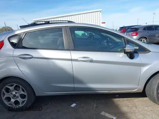 2011 Ford Fiesta SES with VIN 3FADP4FJ1BM149138, listed as a IAAI auction lot 41612288 with 131,798 mi miles. Bid and sale history available at carsss.com. Image 13.