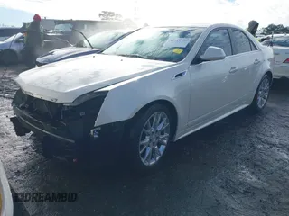 2012 Cadillac CTS Premium with VIN 1G6DP5E3XC0144157, listed as a IAAI auction lot 41311350 with 96,042 mi miles and . Bid and sale history available at DreamBid. Image 2.