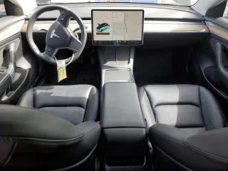 2021 Tesla Model 3 Standard Range Plus with VIN 5YJ3E1EA7MF053663, listed as a Copart auction lot 51982265 with 90,529 mi miles and Salvage Title. Bid and sale history available at DreamBid. Image 8.