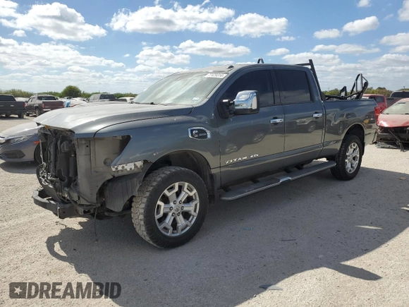 2016 Nissan Titan XD PRO-4X with VIN 1N6BA1F47GN512757, listed as a Copart auction lot 77429314 with 152,756 mi miles and Salvage Title. Bid and sale history available at carsss.com. Image 1.