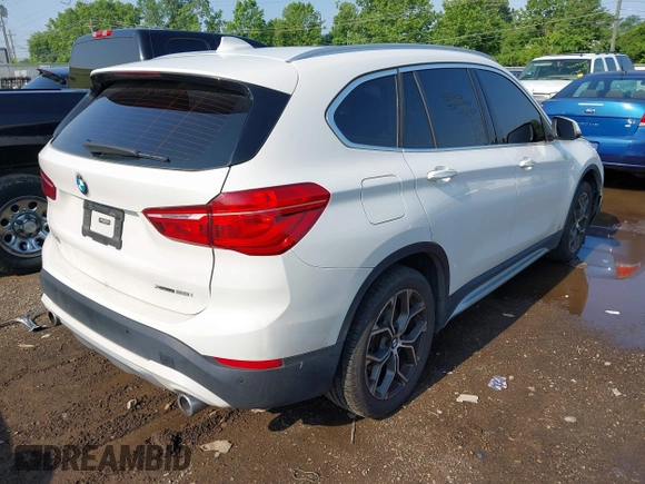 2021 BMW X1 xDrive28i with VIN WBXJG9C02M3M42379, listed as a IAAI auction lot 42476221 with 60,412 mi miles and . Bid and sale history available at DreamBid. Image 4.