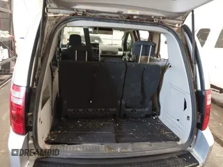 2010 Dodge Grand Caravan SXT with VIN 2D4RN5D15AR261319, listed as a IAAI auction lot 41877022 with 142,292 mi miles and . Bid and sale history available at DreamBid. Image 17.
