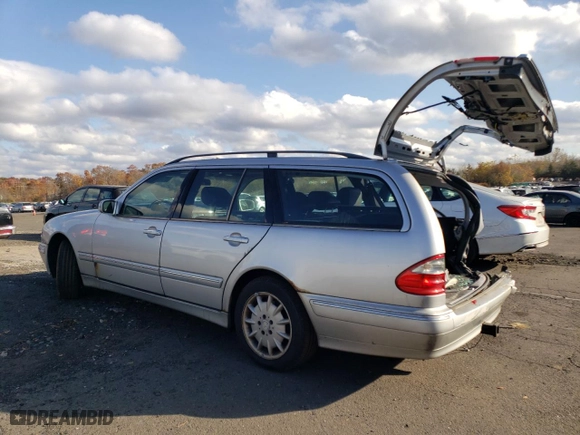 2002 Mercedes-Benz E-Class with VIN WDBJH82J02X069975, listed as a Copart auction lot 75993334 with 246,294 mi miles and Salvage Title. Bid and sale history available at carsss.com. Image 2.