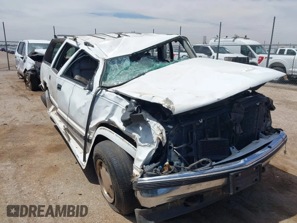 1999 GMC Suburban with VIN 1GDFK16R0XJ728255, listed as a IAAI auction lot 42230595 with Not provided miles and . Bid and sale history available at DreamBid. Image 6.
