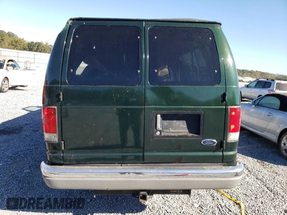 1999 Ford Econoline Passenger XL with VIN 1FBSS31L0XHB12679, listed as a Copart auction lot 74257504 with 136,821 mi miles and Salvage Title. Bid and sale history available at DreamBid. Image 6.
