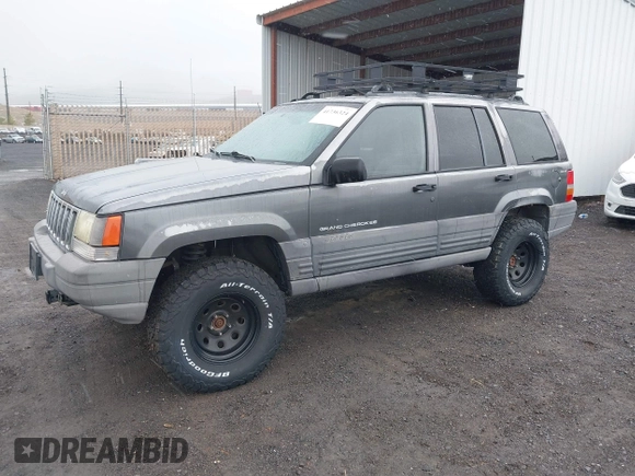 1997 Jeep Grand Cherokee Laredo with VIN 1J4GZ58Y8VC624804, listed as a IAAI auction lot 41736324 with 165,851 mi miles. Bid and sale history available at carsss.com. Image 2.