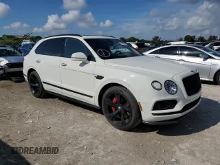 2019 Bentley Bentayga V8 z VIN SJAAM2ZV7KC025449, wystawiony jako Copart lot #62903583 z przebiegiem 12 615 mil mil oraz . Historia ofert i sprzedaży dostępna na DreamBid. Obrazek 4.