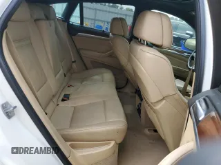 2014 BMW X6 xDrive35i z VIN 5UXFG2C5XE0C43042, wystawiony jako Copart lot #56151565 z przebiegiem Nie podano mil oraz Tytuł czysty. Historia ofert i sprzedaży dostępna na DreamBid. Obrazek 11.