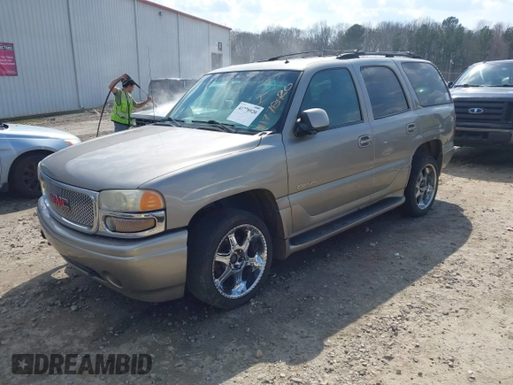 2002 GMC Yukon Denali z VIN 1GKEK63U52J202688, wystawiony jako IAAI lot #41778920 z przebiegiem 354 202 mil mil oraz . Historia ofert i sprzedaży dostępna na DreamBid. Obrazek 2.