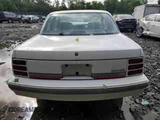 1996 Oldsmobile Cutlass Ciera 1SA VX5 z VIN 1G3AJ55M0T6399357, wystawiony jako Copart lot #60722234 z przebiegiem 128 495 mil mil oraz Szkody całkowita. Historia ofert i sprzedaży dostępna na DreamBid. Obrazek 6.