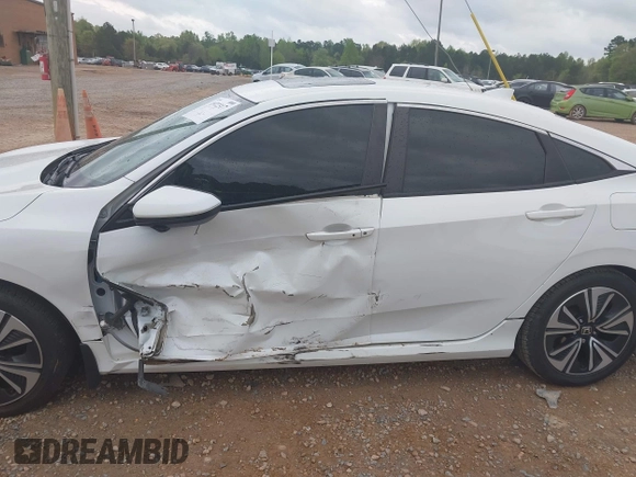 2017 Honda Civic EX-L with VIN 2HGFC1F72HH658763, listed as a IAAI auction lot 41972317 with 166,168 mi miles and . Bid and sale history available at DreamBid. Image 18.