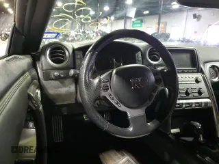 2009 Nissan GT-R Premium с VIN JN1AR54F89M252013, выставлен на аукционе Copart как лот 70656764 с пробегом 66 085 миль миль и Списание • Salvage title. История ставок и продаж доступна на DreamBid. Изображение 5.