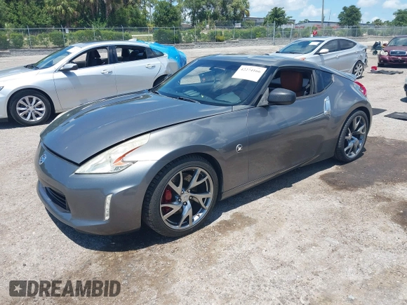2013 Nissan 370Z Touring z VIN JN1AZ4EH2DM384011, wystawiony jako IAAI lot #42274166 z przebiegiem 87 499 mil mil oraz . Historia ofert i sprzedaży dostępna na DreamBid. Obrazek 17.