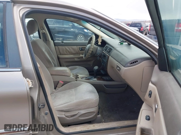2002 Mercury Sable GS z VIN 1MEFM50U52A643924, wystawiony jako IAAI lot #41900910 z przebiegiem 150 413 mil mil oraz . Historia ofert i sprzedaży dostępna na DreamBid. Obrazek 5.