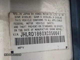 1999 Honda CR-V EX with VIN JHLRD1860XC056641, listed as a IAAI auction lot 42018329 with 321,707 mi miles. Bid and sale history available at carsss.com. Image 9.