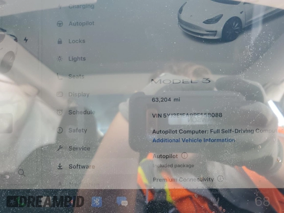 2023 Tesla Model 3 with VIN 5YJ3E1EA9PF558088, listed as a Copart auction lot 52228465 with 63,204 mi miles and Salvage title. Bid and sale history available at DreamBid. Image 9.