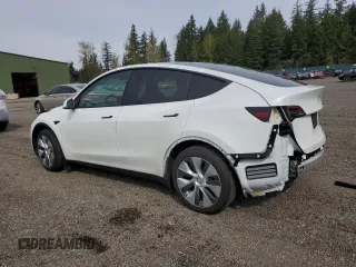 2023 Tesla Model Y Long Range with VIN 7SAYGDEE6PA101291, listed as a Copart auction lot 52758115 with 7,250 mi miles and Salvage Title. Bid and sale history available at DreamBid. Image 2.