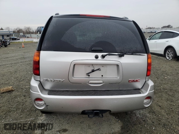 2004 GMC Envoy SLE with VIN 1GKDS13S142358446, listed as a Copart auction lot 43383935 with 154,358 mi miles and Salvage Title. Bid and sale history available at carsss.com. Image 6.