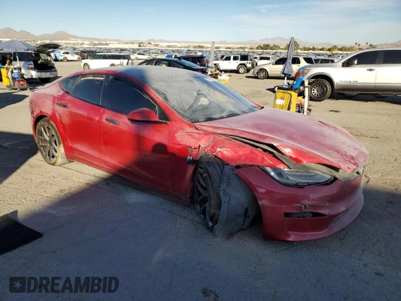 2021 Tesla Model S Plaid z VIN 5YJSA1E65MF435922, wystawiony jako Copart lot #77417854 z przebiegiem Nie podano mil oraz Szkoda całkowita • Salvage title. Historia ofert i sprzedaży dostępna na DreamBid. Obrazek 4.