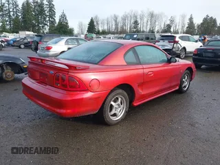 1996 Ford Mustang with VIN 1FALP4042TF223781, listed as a IAAI auction lot 41197025 with 116,106 mi miles. Bid and sale history available at carsss.com. Image 4.