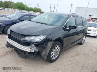 2023 Chrysler Voyager LX with VIN 2C4RC1CG2PR535859, listed as a IAAI auction lot 41920013 with 67,556 mi miles. Bid and sale history available at carsss.com. Image 2.