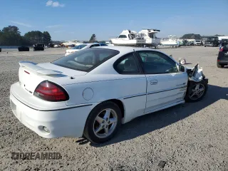 1999 Pontiac Grand Am GT with VIN 1G2NW12EXXM754842, listed as a Copart auction lot 46940335 with 124,886 mi miles and Salvage Title. Bid and sale history available at carsss.com. Image 3.