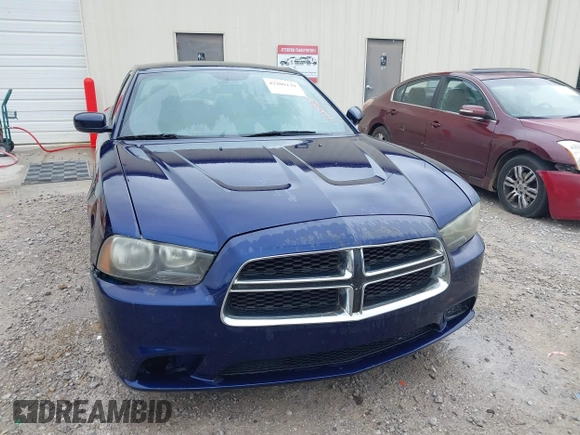 2013 Dodge Charger SE z VIN 2C3CDXBG7DH580034, wystawiony jako IAAI lot #42209139 z przebiegiem 185 906 mil mil oraz . Historia ofert i sprzedaży dostępna na DreamBid. Obrazek 6.