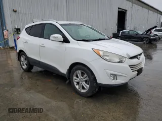 2013 Hyundai Tucson GLS with VIN KM8JU3AC0DU770079, listed as a Copart auction lot 52639835 with 212,894 mi miles and Clean Title. Bid and sale history available at carsss.com. Image 4.