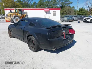 2005 Ford Mustang Deluxe with VIN 1ZVFT80N655136118, listed as a IAAI auction lot 41811969 with 104,071 mi miles. Bid and sale history available at carsss.com. Image 3.