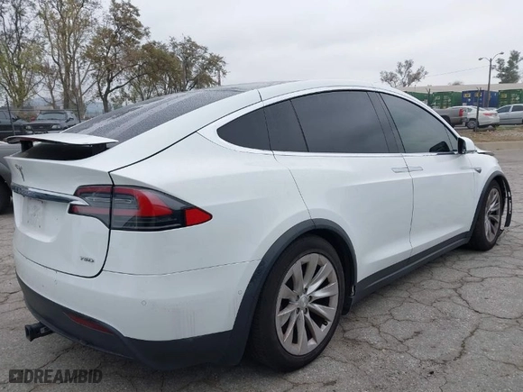 2016 Tesla Model X 70D with VIN 5YJXCBE2XGF013295, listed as a IAAI auction lot 41862736 with 96,190 mi miles. Bid and sale history available at carsss.com. Image 4.