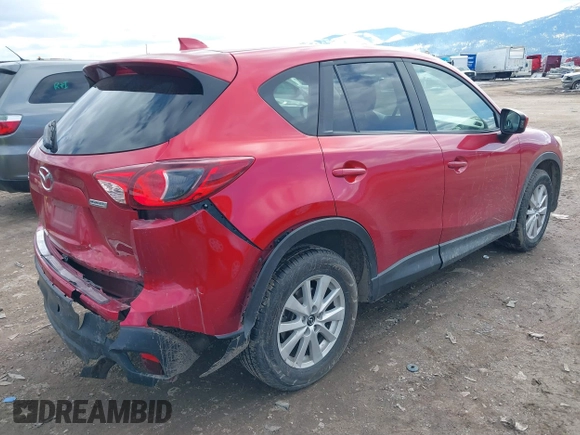 2014 Mazda CX-5 Touring with VIN JM3KE2CY3E0355296, listed as a IAAI auction lot 41688625 with 164,390 mi miles. Bid and sale history available at carsss.com. Image 4.