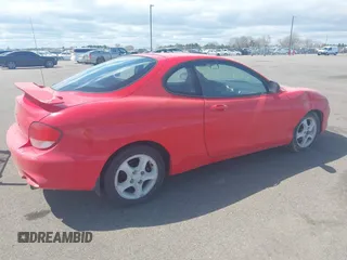 2001 Hyundai Tiburon z VIN KMHJG25F71U226180, wystawiony jako IAAI lot #42123872 z przebiegiem 167 444 mil mil oraz . Historia ofert i sprzedaży dostępna na DreamBid. Obrazek 4.
