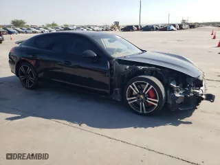 2014 Porsche Panamera GTS with VIN WP0AF2A73EL083388, listed as a Copart auction lot 74312004 with 106,386 mi miles and Salvage Title. Bid and sale history available at carsss.com. Image 4.
